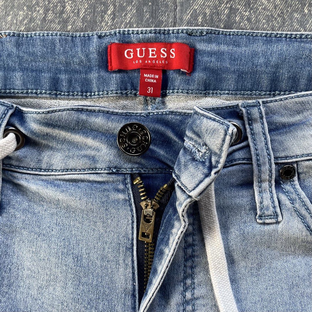 Guess Distressed Denim Shorts Size 31 (Category: Shorts) located in Bato. Submitted by pandadada01 (Listing ID 1461018135, Image 3). Description: - Guess light wash denim shorts - Features ripped details - Drawstring waist for adjustable comfort - Classic five-pocket styling - Button and zip fly closure - Ideal for everyday casual wear.