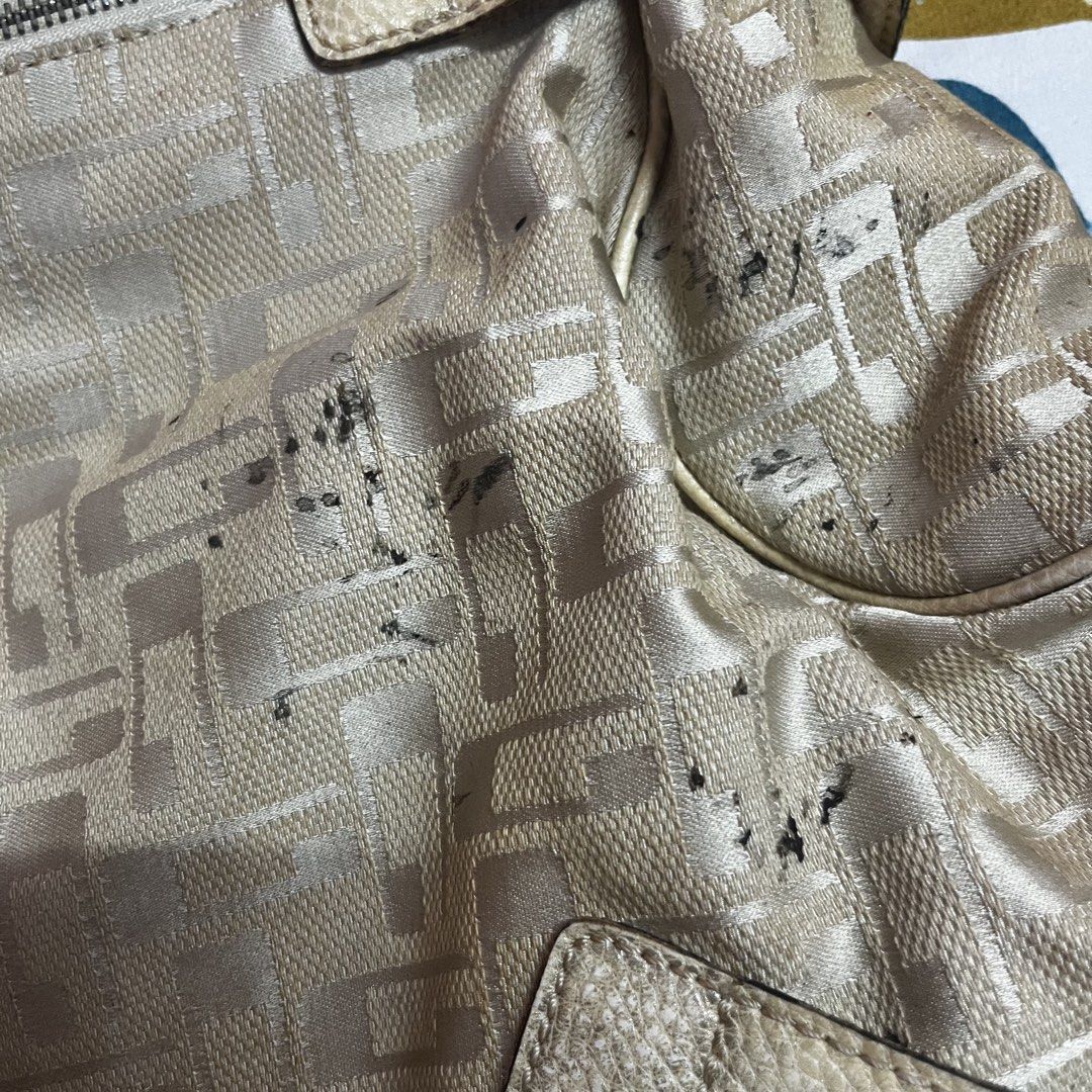 Guess Monogram Shoulder Bag (Category: Luxury Bags & Wallets) located in Caloocan City. Submitted by evermoonlit (Listing ID 1461035889, Image 3). Description: - Cream Guess shoulder bag - All-over monogram pattern - Leather trim and handles - Buckle closures on the front - Top zipper closure - Interior zippered pocket - Note: Some scuffs and marks on fabric, especially on the front.