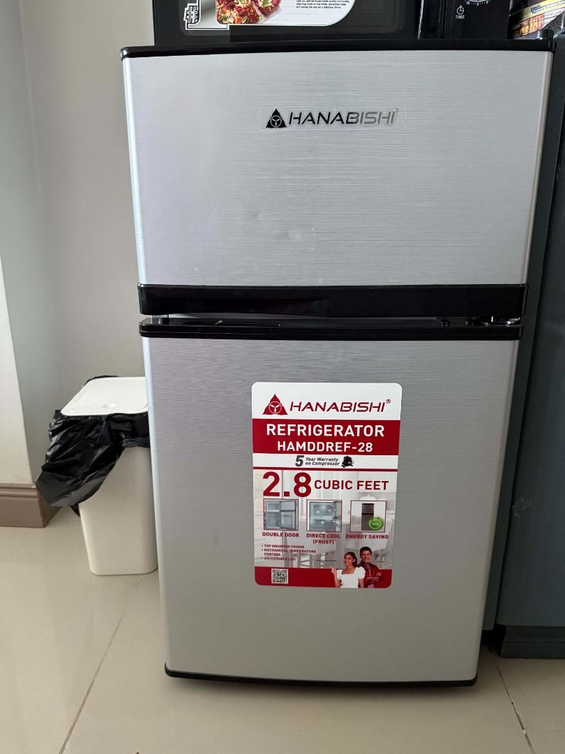 Hanabishi Refrigerator (Category: Refrigerators and Freezers) located in Manila. Submitted by davidlilagan (Listing ID 1460959370, Image 3). Description: - Compact Hanabishi refrigerator, ideal for small spaces. - Selling due to upgrade to a larger unit. - Organized interior with shelves. - Convenient door compartments for eggs and condiments..