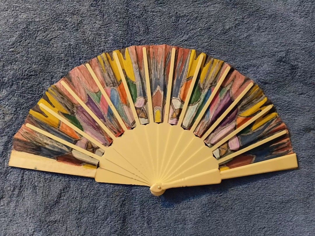 Hand-painted Folding Fan with Colorful Abstract Design from Spain (Category: Fans) located in Manila. Submitted by gt747express (Listing ID 1460947708, Image 2). Description: - Unique hand-painted folding fan - Vibrant, abstract multi-color design - Light cream colored frame - Signed 'Maria Fernandez' - Ideal for decoration or as a unique accessory - Folds neatly for portability size 9 x 17 .