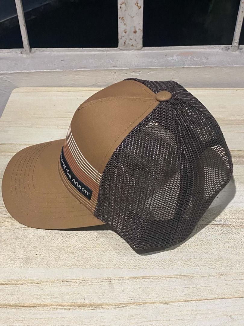 Harley Davidson Trucker Cap - Tan Stripe Design. (Category: Caps & Hats) located in Quezon City. Submitted by carlos132 (Listing ID 1461032188, Image 2). Description: - Classic brown trucker cap - Breathable mesh back for comfort - Stylish striped detail on the front panel - Adjustable strap for a custom fit - Perfect for casual outings and everyday style.