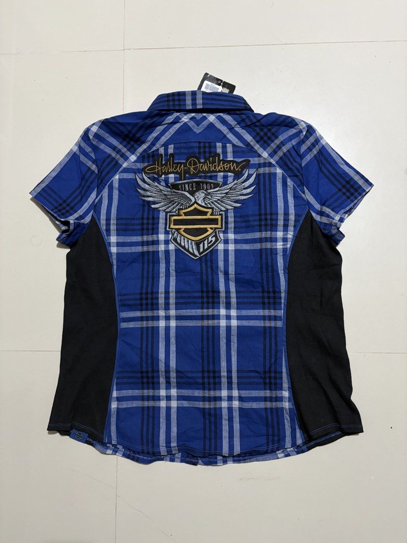 Harley Davidsons (Category: Others Tops) located in Echague. Submitted by jake_rc (Listing ID 1460923999, Image 2). Description: Harley-Davidson 115th Anniversary blue plaid short-sleeve shirt featuring black side panels and “115 Years” embroidery above the chest pocket. For Womens Size XL on tag Dimes 21.5 x 26 Brandnew condition with hangtags Price 850 plus SF.