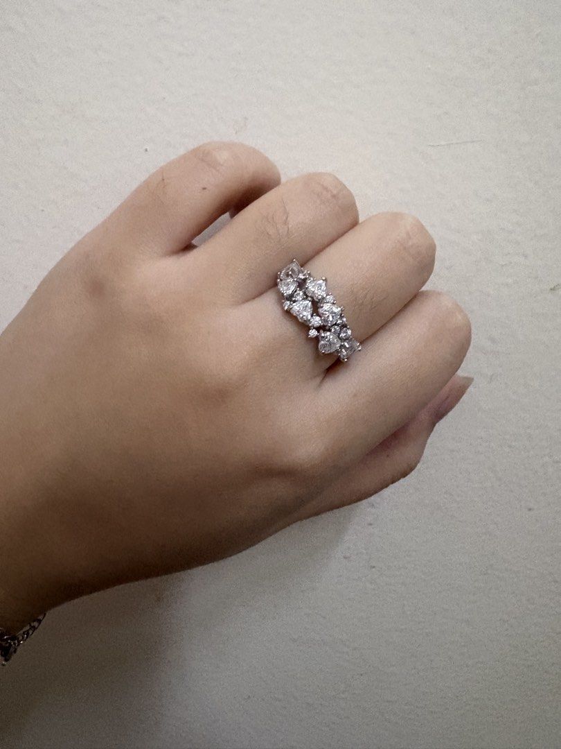 Heart Shape Moissanite Ring S925 Silver band (Category: Rings) located in Manila. Submitted by alyannaros79007 (Listing ID 1461086627, Image 2). Description: - Sparkling ring with multiple heart-shaped stones - Set in elegant silver-tone metal - No certificate included - Beautifully catches the light for added shimmer - Ideal for gifting or personal indulgence - Adds a touch of sparkle to any outfit.