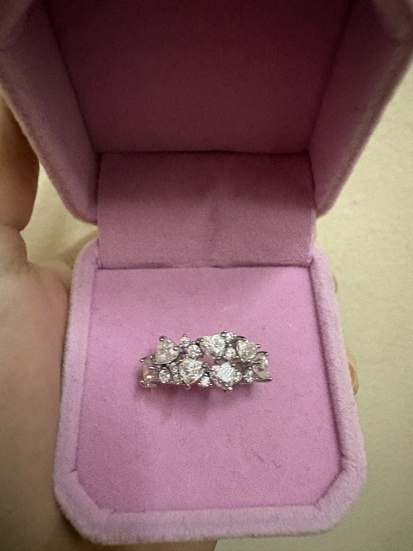 Heart Shape Moissanite Ring S925 Silver band (Category: Rings) located in Manila. Submitted by alyannaros79007 (Listing ID 1461086627, Image 3). Description: - Sparkling ring with multiple heart-shaped stones - Set in elegant silver-tone metal - No certificate included - Beautifully catches the light for added shimmer - Ideal for gifting or personal indulgence - Adds a touch of sparkle to any outfit.
