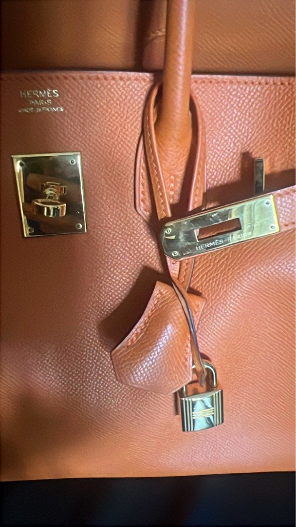 Hermes Birkin Orange Leather Gold Hardware B30 (Category: Luxury Bags & Wallets) located in Muntinlupa City. Submitted by john173 (Listing ID 1460945035, Image 3). Description: - Genuine orange leather handbag - Elegant gold hardware details - Includes original lock and keys - Comfortable top handles for carrying - Timeless structured design - Versatile for daily use or special events Stamp M, complete with dustbag, raincoat Guaranteed authentic.