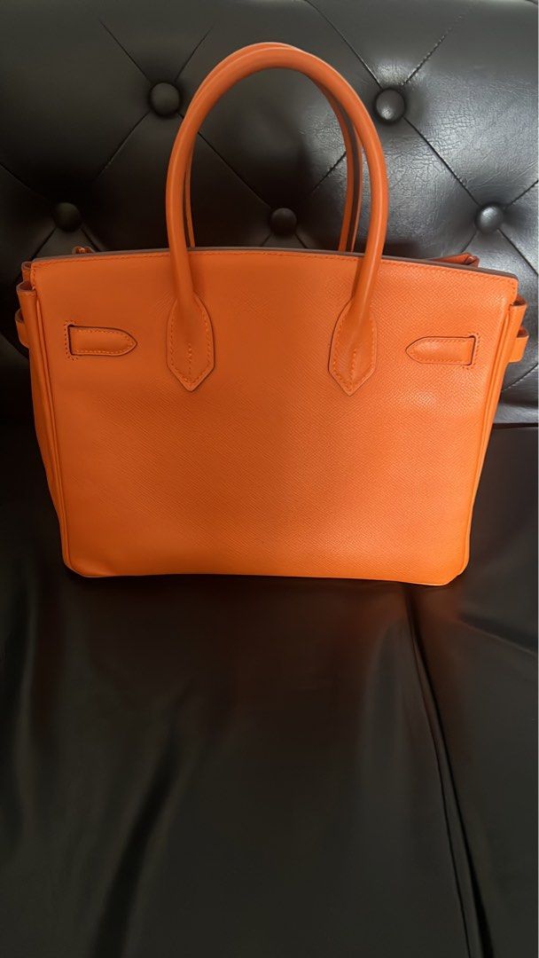 Hermes Birkin Orange Leather Gold Hardware B30 (Category: Luxury Bags & Wallets) located in Muntinlupa City. Submitted by john173 (Listing ID 1460945035, Image 2). Description: - Genuine orange leather handbag - Elegant gold hardware details - Includes original lock and keys - Comfortable top handles for carrying - Timeless structured design - Versatile for daily use or special events Stamp M, complete with dustbag, raincoat Guaranteed authentic.