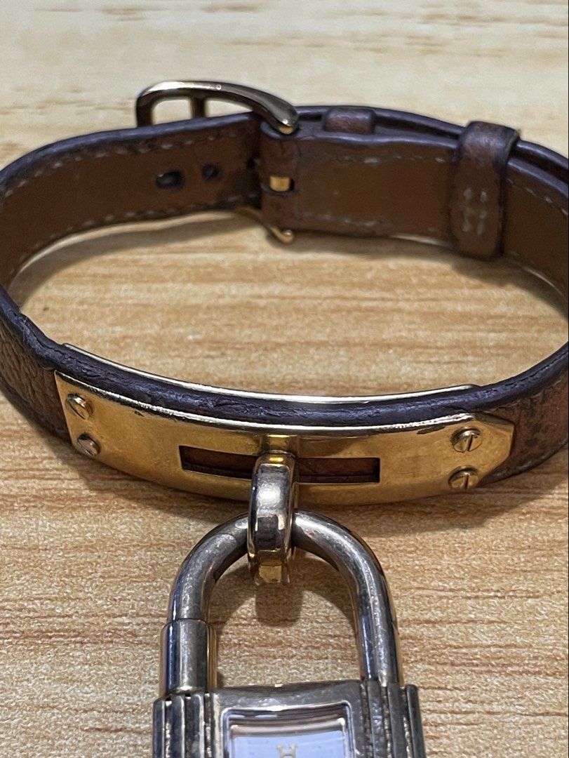 Hermes kelly (Category: Women's Watches) located in Taguig. Submitted by tester1x (Listing ID 1460940715, Image 2). Description: Hermes Kelly Padlock Watch Swiss Made Quartz 2390356 Gold color dial Stainless steel case Hermes leather strap buckle 20mm .
