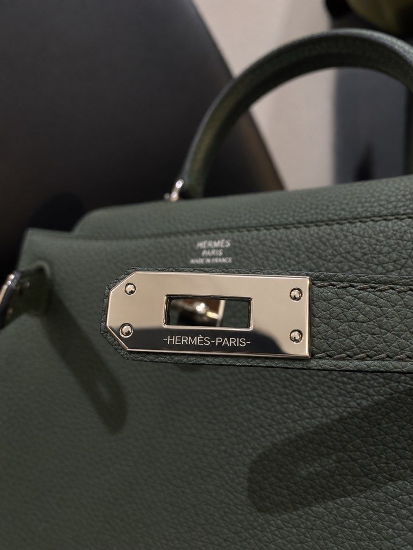 Hermes Kelly 25 Vert Amande (Category: Luxury Bags & Wallets) located in Alfonso. Submitted by harper_preloved (Listing ID 1461036587, Image 3). Description: Selling Hermès Kelly 25 in this truly unique Vert Amande colorway! As the name suggests, Vert Amande is a sophisticated blend of green and grey. The tone shifts depending on the lighting. I especially love colors like these because it’s like getting two bags in one 2 it’s the perfect “neutra