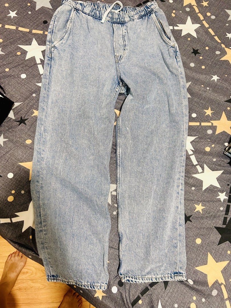 H&M Loose fit pants (Category: Jeans) located in Cavite. Submitted by kyliekaye (Listing ID 1461011484, Image 1). Description: - Brand: H&M - Style: Light wash denim jeans - Fit: Loose fit - Features: Elasticated waistband with drawstring, front and back pockets - Origin: Made in Bangladesh - Measurements (laid flat): Waist approx. 14 inches, Inseam approx. 27 inches - Unisex for men and women.