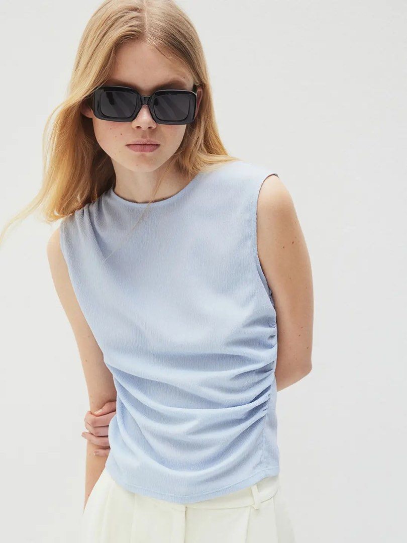 H&M Sleeveless Ruched Top Light Blue - Size M (Category: Sleeveless) located in Angeles City. Submitted by dwnmxn (Listing ID 1461079274, Image 3). Description: Light blue sleeveless top from H&M Size: Medium In very good condition.