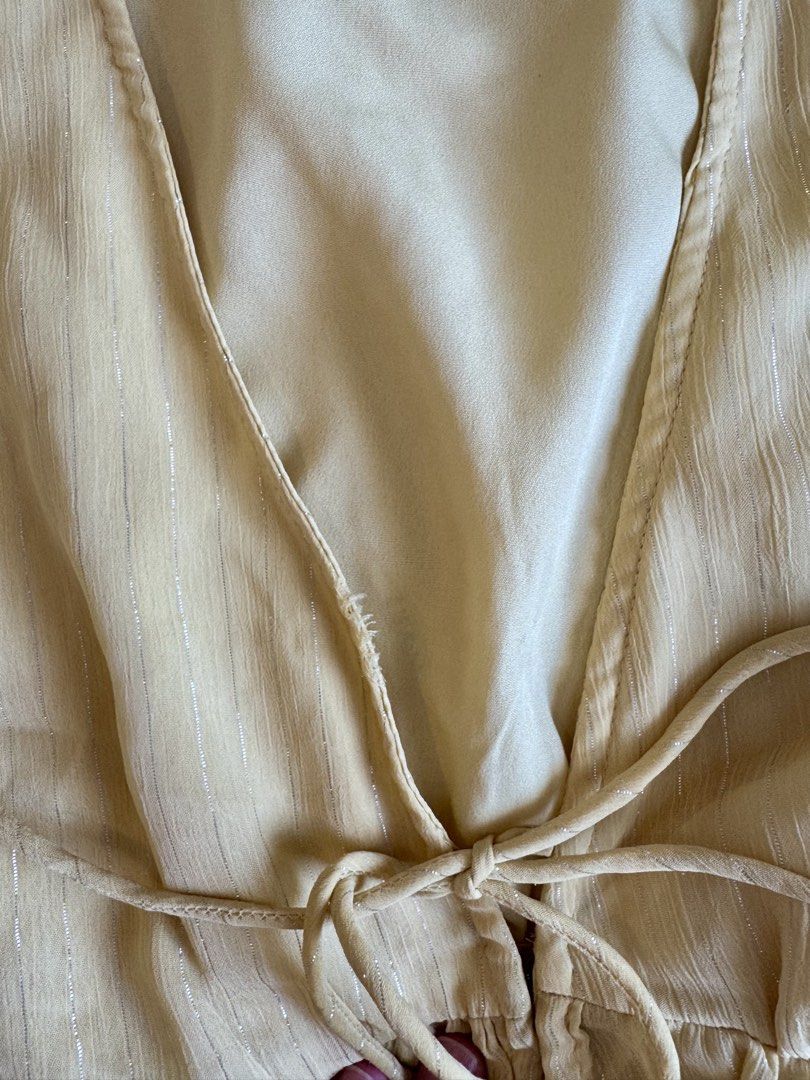 H&M Yellow Ruffle Tie Front Sheer Blouse (Category: Blouses) located in Bacolod City. Submitted by bellabianca_closet (Listing ID 1461050067, Image 3). Description: Disclaimer: 1st photo not mine - Cute yellow top from H&M - Sheer material with subtle vertical stripes - Features ruffle sleeves - Tiered peplum hem for a flattering silhouette - Adjustable tie front detail at the bust - Versatile for dressing up or down - Ideal for summer wear.