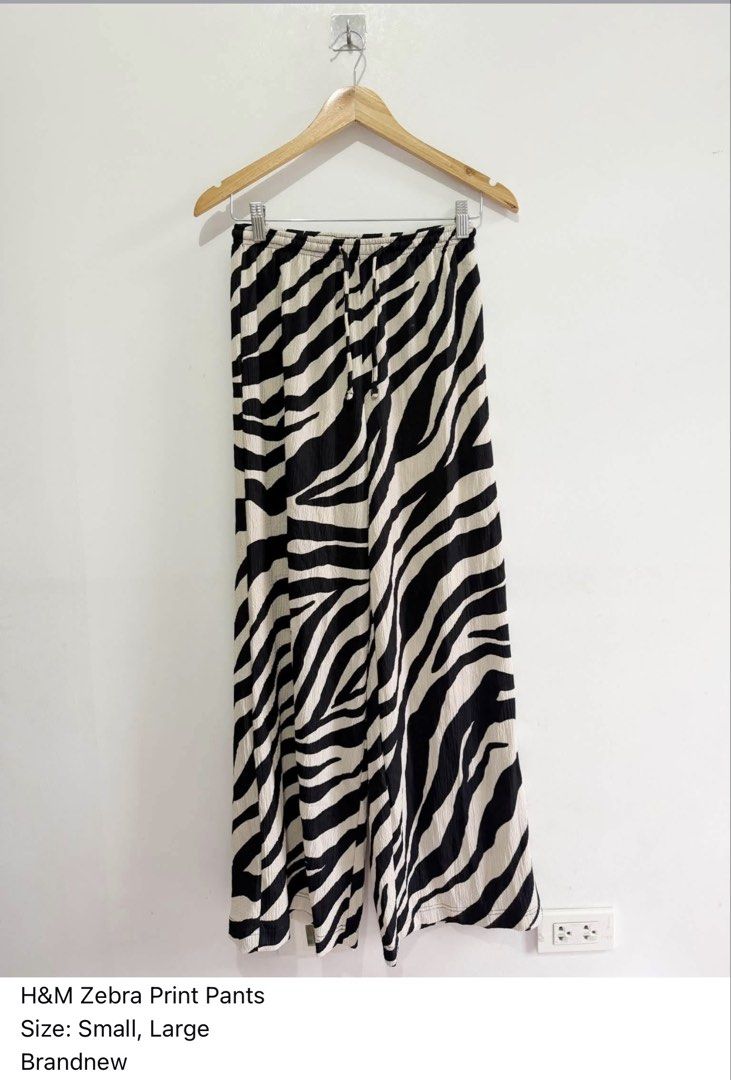 H&M Zebra Print Wide Leg Pants (Category: Other Bottoms) located in Paranaque City. Submitted by closetcoph (Listing ID 1460970025, Image 1). Description: - Brand new H&M zebra print pants - Wide leg style - Drawstring waist - Available in sizes Small (S) and Large (L) - Perfect for a bold, statement look.