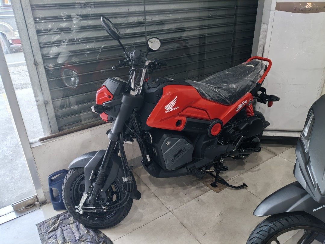 Honda Navi Red Scooter Motorcycle (Category: Motorbikes for Sale) located in Las Pinas. Submitted by quimberlee (Listing ID 1460995216, Image 1). Description: Honda Navi in red. Fun and agile scooter. Easy to maneuver in the city. Great for short rides. Ready for a new owner. Check out the photos for details. also available other colors..