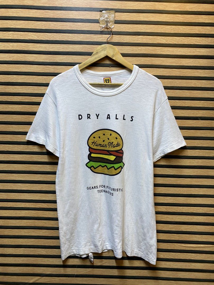 HUMAN MADE “DRY ALLS” BURGER GRAPHIC TEE (Category: Tshirts & Polo Shirts ) located in Makati City. Submitted by drip.poww (Listing ID 1461099174, Image 1). Description: - Authentic Human made - Color: White - Size: Meduim - Dimes: 21x30 - Authentic - Excellent condition - Need wash, fresh from bale - Material: 100% Cotton Please don’t expect too much—these are thrifted (ukay) items. 😊 !!STILL NEGOTIABLE!!.