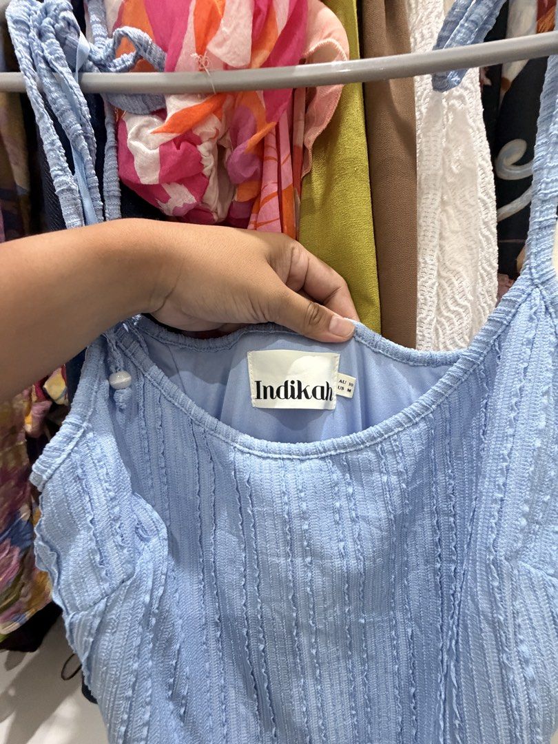 Indikah Blue Textured Midi Dress (Category: Dresses) located in Cebu City. Submitted by shopwitheli (Listing ID 1461080249, Image 2). Description: - Brand: Indikah - Color: Light Blue - Style: Midi Dress - Fabric: Textured with vertical stripes - Features: Adjustable spaghetti straps, ruffled hemline, ties at the back - Occasion: Great for casual day outs or beach trips.
