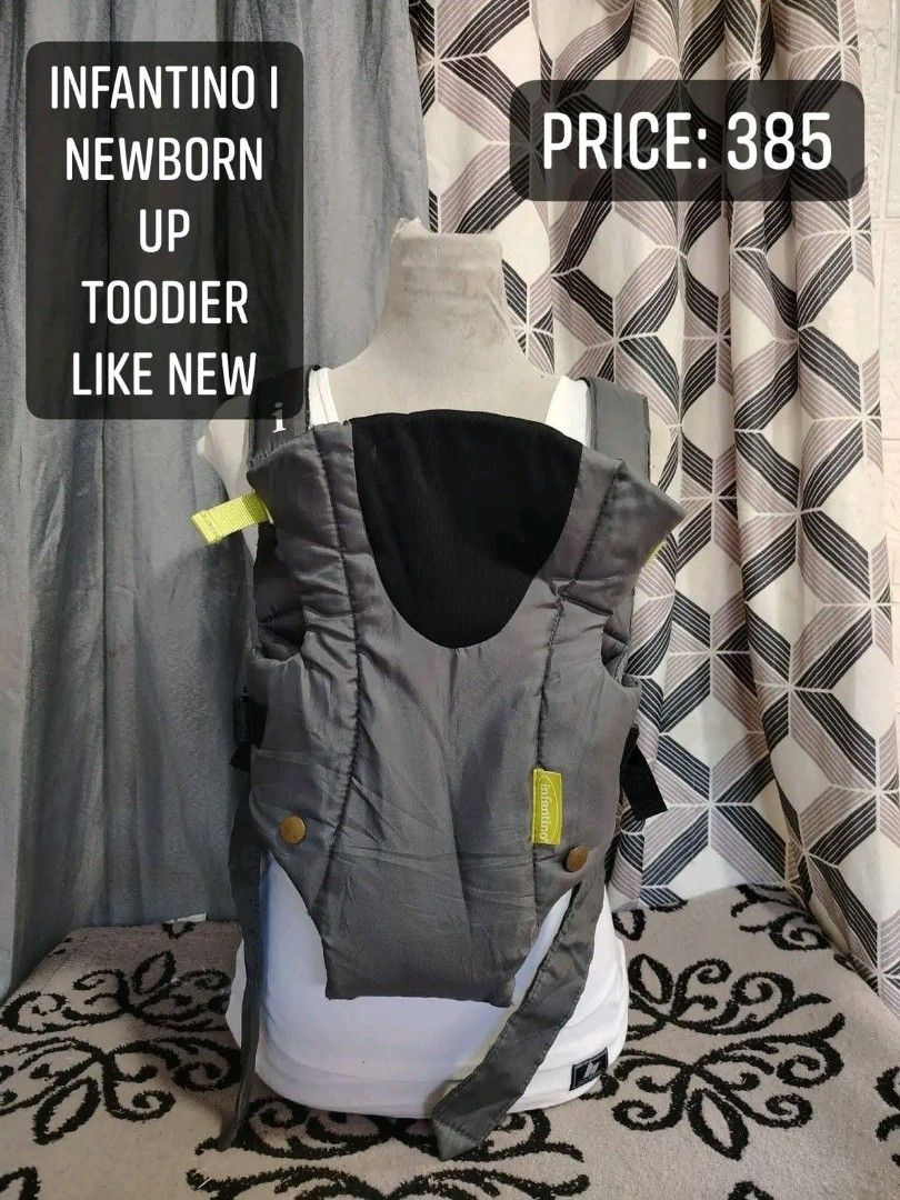 INFANTINO BABY CARRIER (Category: Carriers & Slings) located in Cagayan de Oro. Submitted by littlebabyscarrier (Listing ID 1460990713, Image 2). Description: Infantino Breathe Baby Carrier. This specific model is a lightweight, sporty front carrier featuring a dark grey body fabric paired with high-visibility neon yellow accents and a mesh panel designed for breathability. Core Specifications Positions: 2-way carrying positions (facing inward an