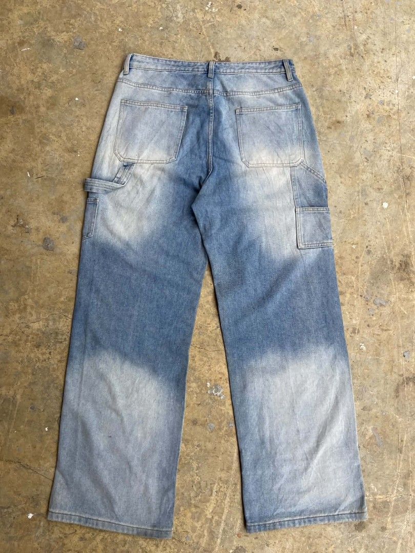 IZRO Double knee Carpenter Blue Denim Baggy Pants (Category: Jeans) located in Lianga. Submitted by arwthrifts (Listing ID 1461038322, Image 2). Description: - Brand: IZRO - Color: Blue Denim - Size: 2XL - Design: Unique paisley patchwork on legs - Style: Carpenter with utility pocket - Fit: Relaxed - Perfect for: Statement streetwear looks - Condition: Please check photos for details.