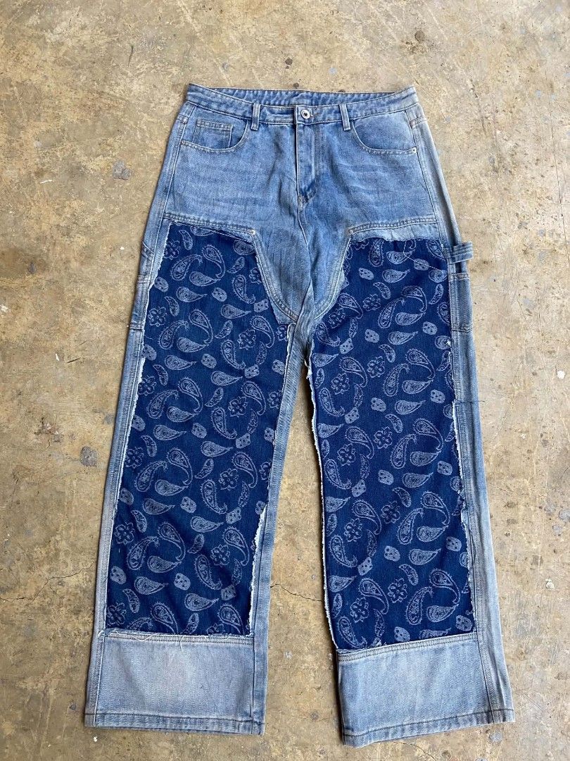 IZRO Double knee Carpenter Blue Denim Baggy Pants (Category: Jeans) located in Lianga. Submitted by arwthrifts (Listing ID 1461038322, Image 1). Description: - Brand: IZRO - Color: Blue Denim - Size: 2XL - Design: Unique paisley patchwork on legs - Style: Carpenter with utility pocket - Fit: Relaxed - Perfect for: Statement streetwear looks - Condition: Please check photos for details.
