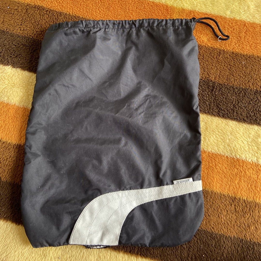 Jil Sander Shoe/Dust Bag (Category: Belt bags, Clutches and Pouches) located in Angeles City. Submitted by eriellynnthrifts (Listing ID 1460946860, Image 1). Description: 2000’s Shoe bag Jil Sander with a drawstring lock..