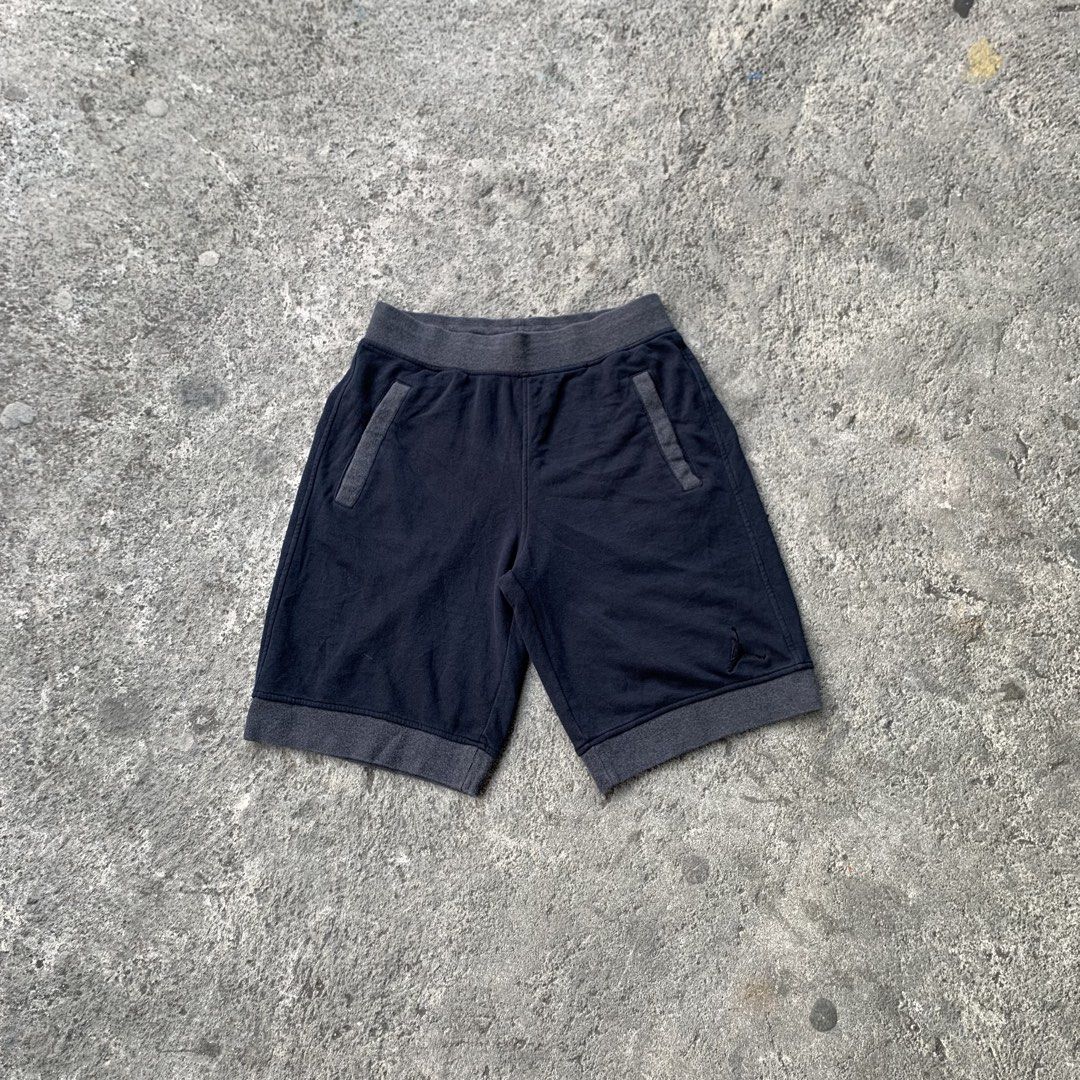 Jordan Jumpman Shorts Navy Blue (Category: Shorts) located in Polangui. Submitted by b0ssl00ts (Listing ID 1460931943, Image 1). Description: - Navy blue Jordan shorts - Grey trim detail - Elastic waistband with drawstring - Two side pockets - One back pocket - Small Jumpman logo on left leg - Comfortable for lounging and workouts - Ideal for Jordan enthusiasts.