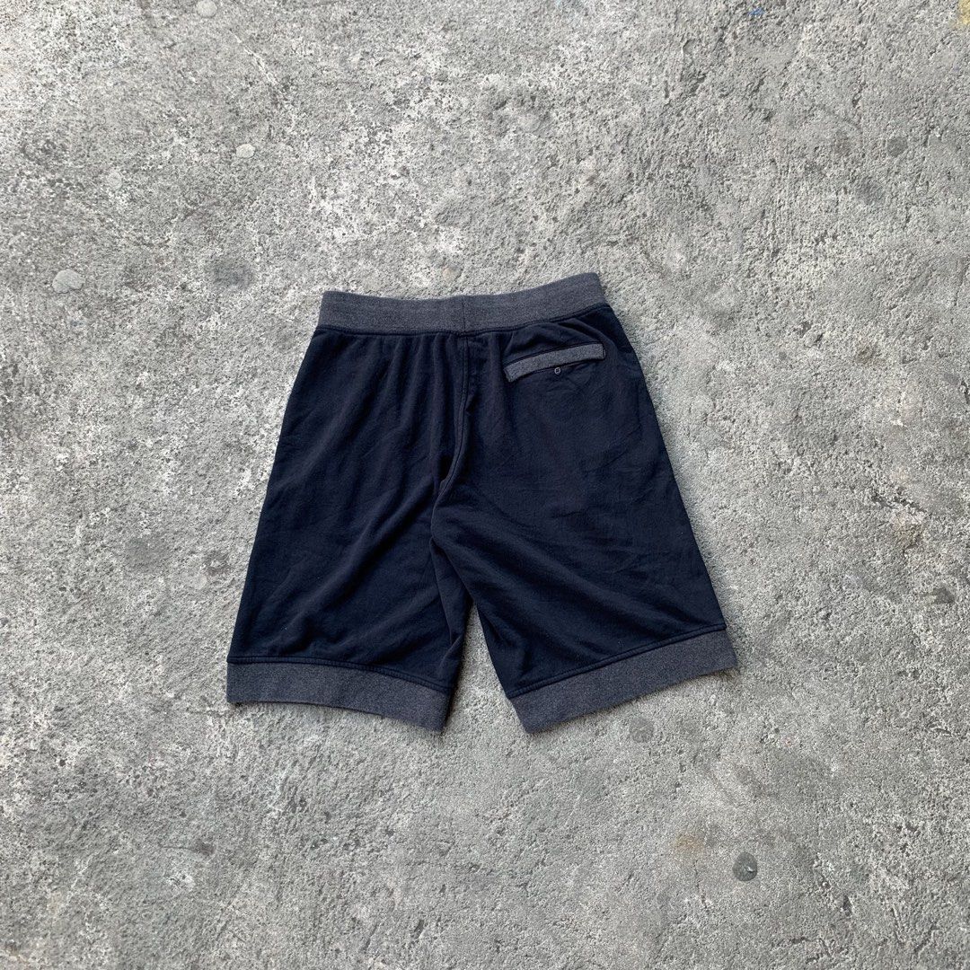 Jordan Jumpman Shorts Navy Blue (Category: Shorts) located in Polangui. Submitted by b0ssl00ts (Listing ID 1460931943, Image 3). Description: - Navy blue Jordan shorts - Grey trim detail - Elastic waistband with drawstring - Two side pockets - One back pocket - Small Jumpman logo on left leg - Comfortable for lounging and workouts - Ideal for Jordan enthusiasts.