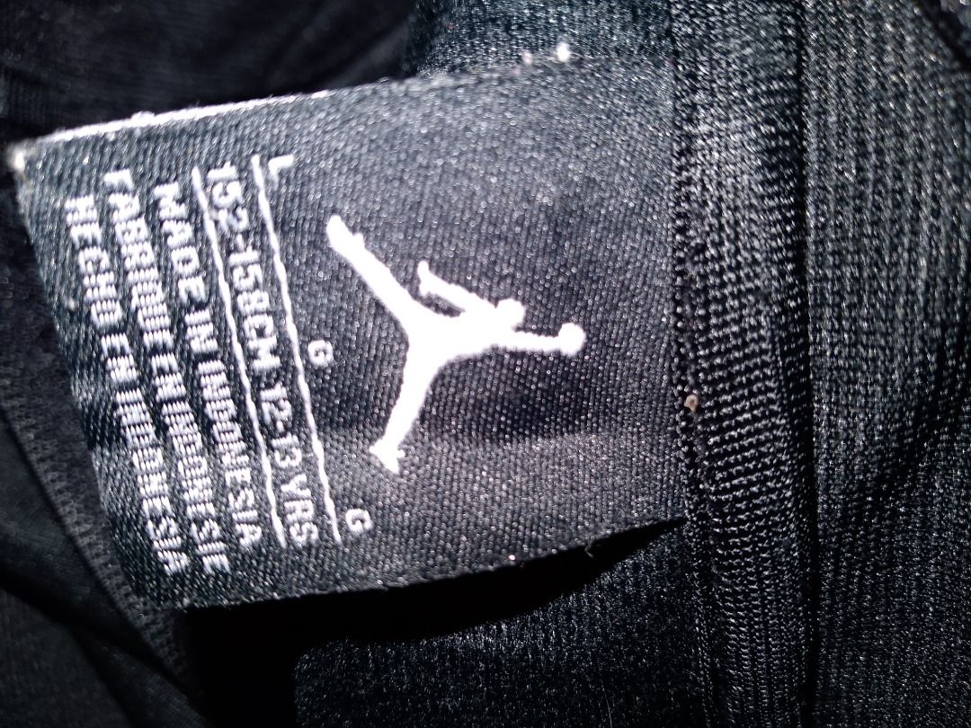 Jordan Track Jacket Black Size L (Category: Coats, Jackets and Outerwear) located in Caloocan City. Submitted by akosiwaron_thrift2600 (Listing ID 1460966801, Image 3). Description: - Authentic Jordan track jacket - Features iconic Jumpman logo and Jordan text graphic - Made in Indonesia - Size L (fits 12-13 years or 152-158cm) - Ideal for casual wear or sports activities.