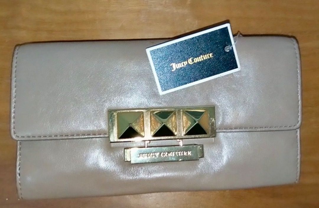 Juicy Couture Brown Leather Wallet with Gold Studs (Category: Wallets & Card holders) located in Makati City. Submitted by pre_loved_items_.moon (Listing ID 1456447167, Image 1). Description: - Genuine brown leather Juicy Couture wallet - Elegant gold hardware with stud details on the front clasp - Multiple interior card slots and compartments for organization - Convenient zippered pocket for coins or small items - Comes with original tag attache