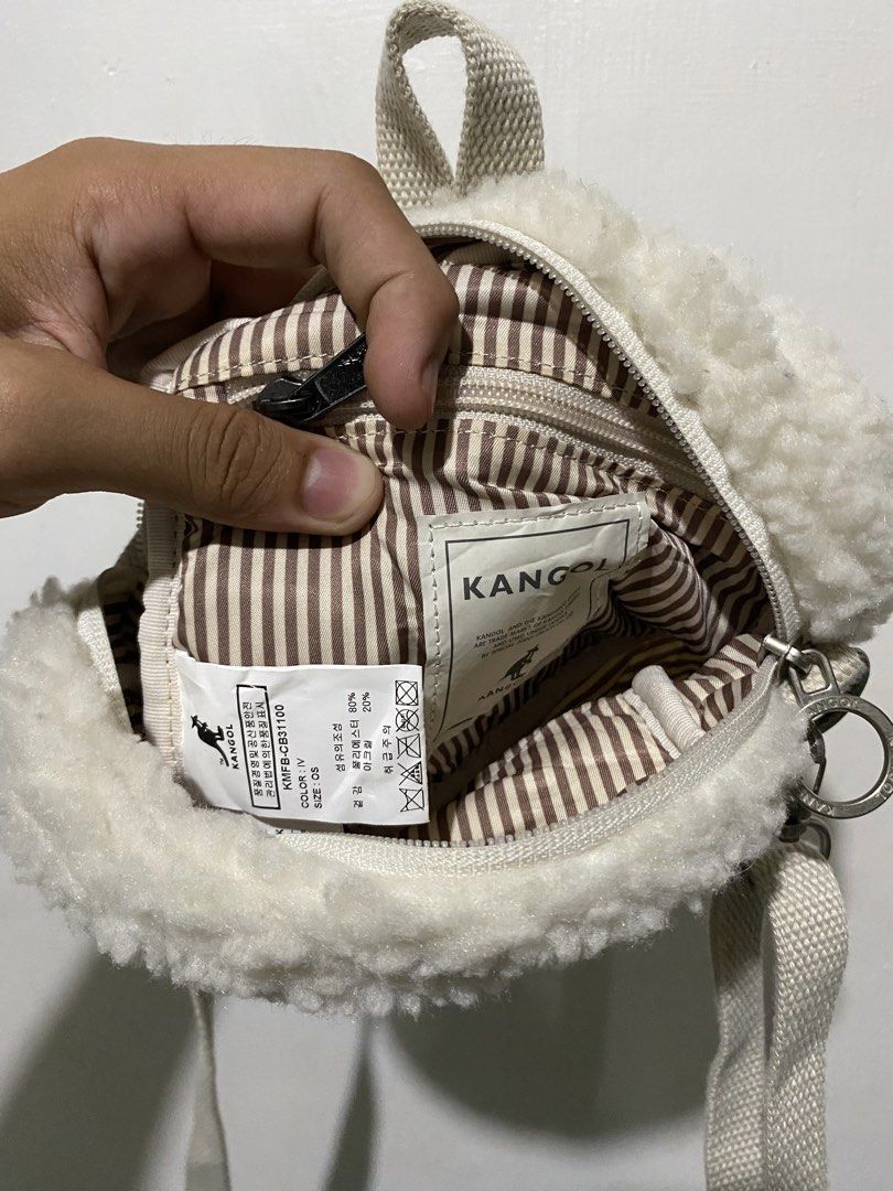 KANGOL (Category: Cross-body Bags) located in General Santos City (Dadiangas). Submitted by itzzur.rapi (Listing ID 1460929711, Image 3). Description: This item is an ivory-colored faux-fur/fleece crossbody bag from Kangol, specifically resembling the Kangol Poodle III Square or Tambourine fuzzy cross-body bag..