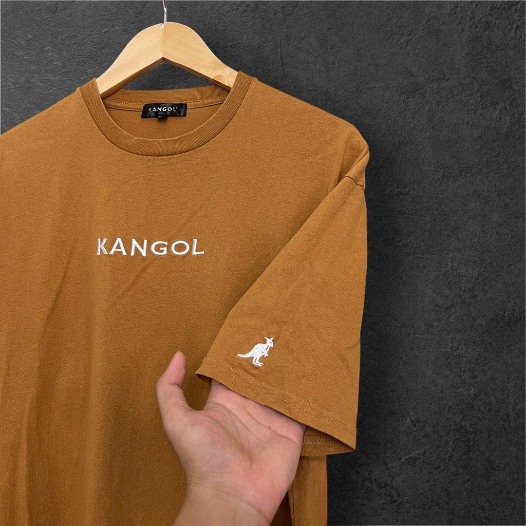 KANGOL CAMEL-BROWN SCRIPT LOGO (Category: Tshirts & Polo Shirts ) located in Solano. Submitted by brokeboyzsupply (Listing ID 1461069766, Image 3). Description: Size: L Width: 21 Length: 29 Color rate: 10/10 Condition: 10/10 Issue/s: None - All embroidered “Color may vary due to lighting”.
