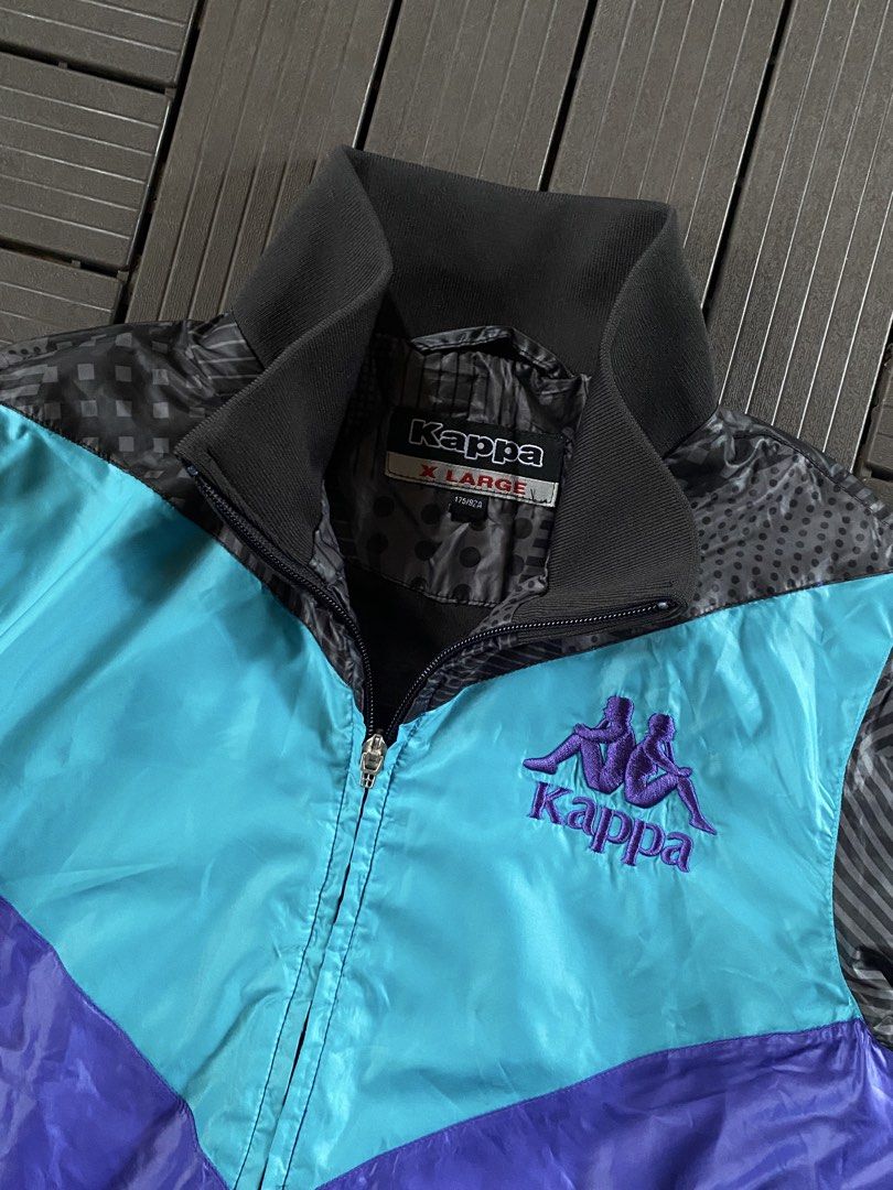 Kappa Track Jacket X Large Teal Purple Black (Category: Coats, Jackets and Outerwear) located in Puerto Princesa. Submitted by streetnfinds (Listing ID 1461071700, Image 3). Description: Length: 24" Width: 19.5" Sleeve Length: 25" Medium - Awesome Kappa track jacket - Iconic Kappa logo on chest - Colorblocked design: Teal, Purple, Black - Cool all-over graphic print on back - Zipper closure with pockets - Size: X Large (XL).