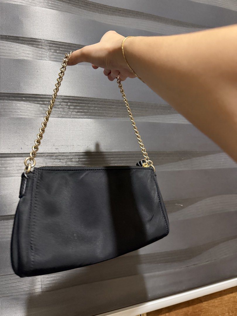 Kate Spade Black Nylon Chain Shoulder Bag (Category: Luxury Bags & Wallets) located in Muntinlupa City. Submitted by biancaagbscloset (Listing ID 1461107054, Image 2). Description: - Brand: Kate Spade - Color: Black - Material: Nylon - Strap: Gold chain shoulder strap - Closure: Zipper - Interior: Branded lining with a small zip pocket - Condition: Clean inside and out - Perfect for: Carrying daily essentials.