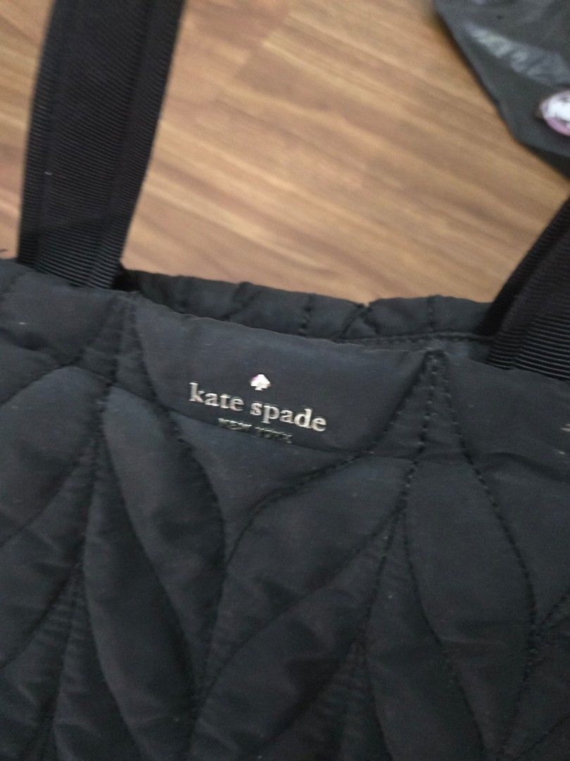 Kate Spade Black Quilted Tote Bag (Category: Tote Bags) located in Makati City. Submitted by skye_store (Listing ID 1461071050, Image 2). Description: - Authentic Kate Spade New York quilted tote bag - Classic Kate Spade logo tag - Black and white chevron patterned straps - Small tear on top seam (visible in last photo) - Otherwise in good, pre-loved condition.