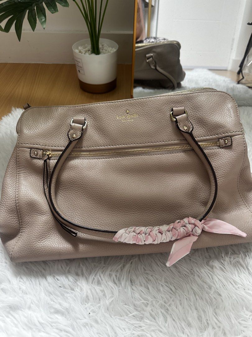 Kate Spade Pebble Leather Satchel Bag (Category: Luxury Bags & Wallets) located in Makati City. Submitted by findsbysai (Listing ID 1460953174, Image 1). Description: - Light pink Kate Spade satchel bag - Made of durable pebble leather - Interior features a fun striped pattern and multiple compartments - Elegant gold-tone hardware - Comes with a cute floral scarf tied to the handle - Spacious enough for all your daily essentials - Ideal for every