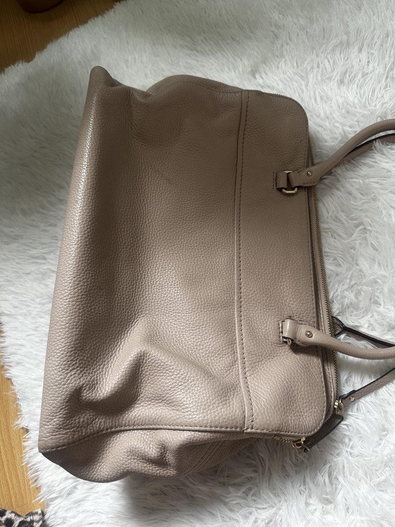 Kate Spade Pebble Leather Satchel Bag (Category: Luxury Bags & Wallets) located in Makati City. Submitted by findsbysai (Listing ID 1460953174, Image 3). Description: - Light pink Kate Spade satchel bag - Made of durable pebble leather - Interior features a fun striped pattern and multiple compartments - Elegant gold-tone hardware - Comes with a cute floral scarf tied to the handle - Spacious enough for all your daily essentials - Ideal for every
