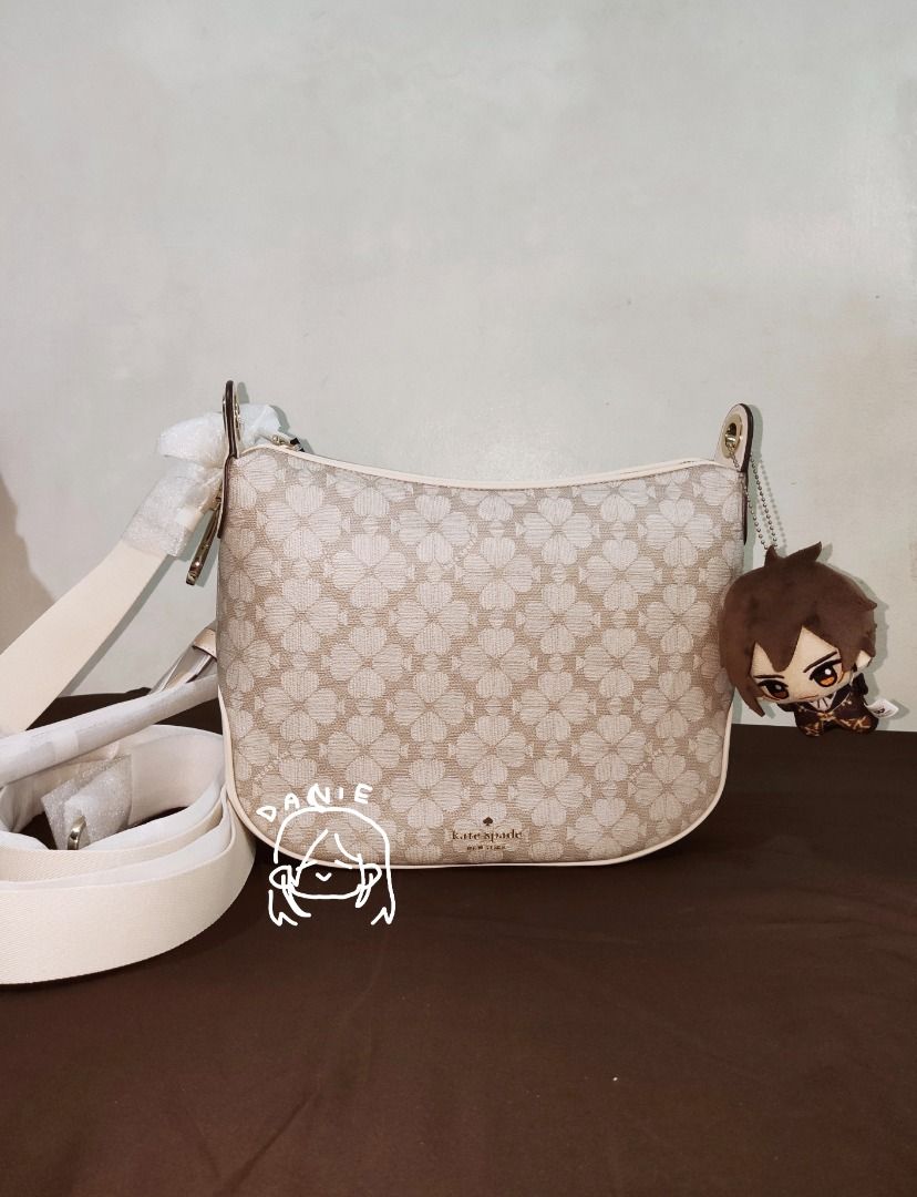 Kate Spade Shoulder Bag with Matching Pouch (Category: Luxury Bags & Wallets) located in Caloocan City. Submitted by fukurodanie (Listing ID 1461065013, Image 2). Description: KATE SPADE SIGNATURE SPADE FLOWER PVC CROSSBODY ✨ Authentic ✨ Never used ✨ Original price: 399 USD 👉 Other items in photo NOT included; only there for size reference.