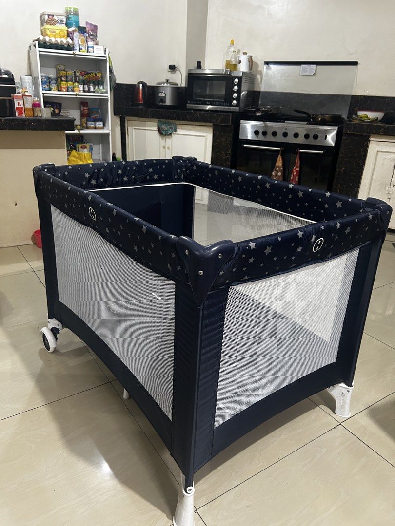 KATOJI Baby Playpen with Star Pattern (Category: Cots & Cribs) located in Taguig. Submitted by ghiebow06 (Listing ID 1460973637, Image 3). Description: - Navy blue playpen with cute star pattern - Mesh sides for excellent ventilation - Equipped with wheels for easy mobility - Folds down for convenient storage - Provides a safe and entertaining space for your little one.