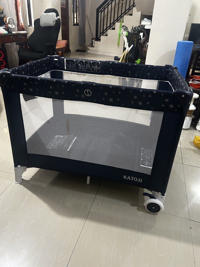 KATOJI Baby Playpen with Star Pattern (Category: Cots & Cribs) located in Taguig. Submitted by ghiebow06 (Listing ID 1460973637, Image 2). Description: - Navy blue playpen with cute star pattern - Mesh sides for excellent ventilation - Equipped with wheels for easy mobility - Folds down for convenient storage - Provides a safe and entertaining space for your little one.