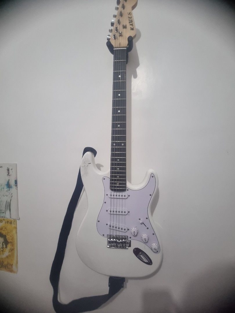KAWES White Electric Guitar (Category: Musical Instruments) located in Kalibo. Submitted by zealmoon_00102e (Listing ID 1461080560, Image 1). Description: - White electric guitar with a Stratocaster-style body. - Comes with a black guitar strap. - Ready to play right out of the box. - Ideal for beginner guitarists or as a Kawes E Guitar ₱3000 Fresh Strings Ernie Ball 2723 Cobalt Super Slinky 9-42 Freebies: Cable Capo Guitar Strap 1 year palang RF