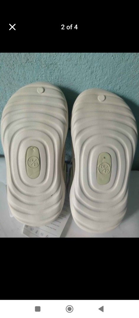 Kids' Sandals with Minecraft Charms (Category: Babies & Kids Fashion) located in Cavite. Submitted by jakeped86911 (Listing ID 1461054861, Image 2). Description: - Cute light-colored sandals for kids - Features fun Minecraft-themed charms - Easy slip-on and off design - Textured grip soles for safety - Ideal for casual wear - Comes in original packaging.
