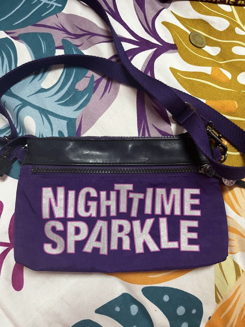 Kipling Purple "Nighttime Sparkle" Crossbody Bag (Category: Cross-body Bags) located in Caloocan City. Submitted by evermoonlit (Listing ID 1461036081, Image 1). Description: - Purple Kipling crossbody bag with "Nighttime Sparkle" graphic - Zipped main compartment and front zip pocket - Classic Kipling monkey print lining inside - Adjustable strap - Ideal for everyday use or travel.