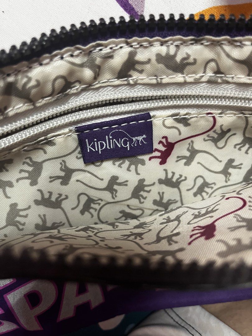 Kipling Purple "Nighttime Sparkle" Crossbody Bag (Category: Cross-body Bags) located in Caloocan City. Submitted by evermoonlit (Listing ID 1461036081, Image 2). Description: - Purple Kipling crossbody bag with "Nighttime Sparkle" graphic - Zipped main compartment and front zip pocket - Classic Kipling monkey print lining inside - Adjustable strap - Ideal for everyday use or travel.