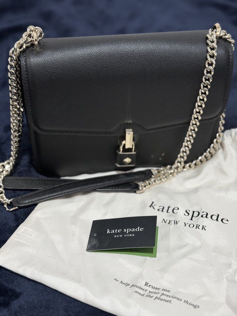 KS Black Leather Lock Shoulder Bag (Category: Luxury Bags & Wallets) located in Batangas. Submitted by cathevans (Listing ID 1460977338, Image 2). Description: - Authentic Kate Spade shoulder bag - Color: Black - Material: Pebbled leather - Closure: Gold lock - Strap: Chain strap - Includes: Dust bag - Original tag with Suggested Retail Price (SRP) attached.
