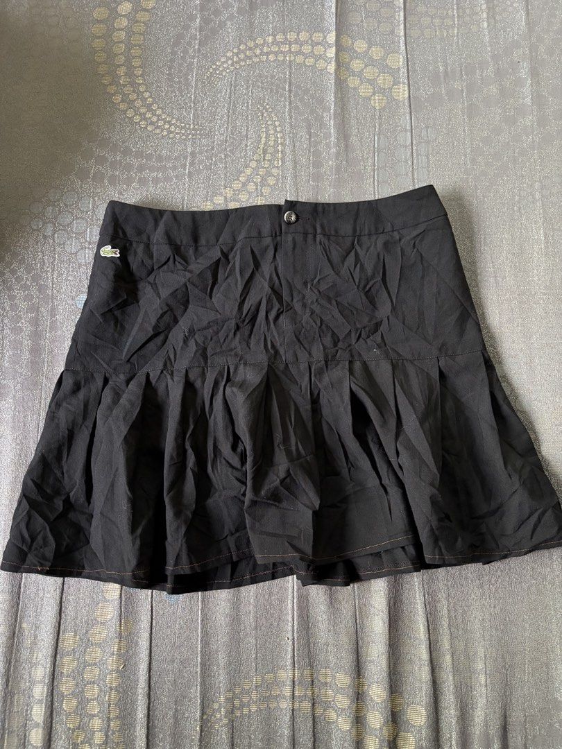 Lacoste Black Pleated Mini Skirt Size 40 (Category: Skirts) located in Tagbilaran City. Submitted by noeeeelll (Listing ID 1461047810, Image 1). Description: - Black pleated mini skirt by Lacoste - Iconic crocodile logo on left hip - Made in France - Size 40 - Ideal for casual or sporty looks.