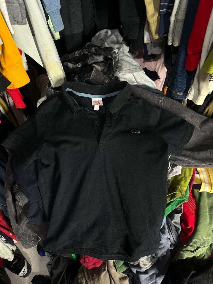 Lacoste black polo shirt (Category: Tshirts & Polo Shirts ) located in Manila. Submitted by nb_thriftshop (Listing ID 1461066090, Image 1). Description: 24 length 19 width medium no issue like new washed.