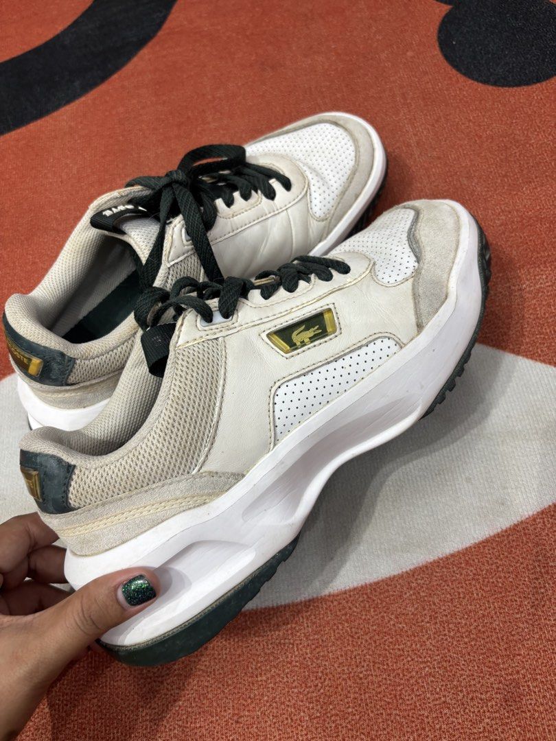 Lacoste White and Green Sneakers (Category: Sneakers) located in Alicia. Submitted by thriftbagph (Listing ID 1461078433, Image 2). Description: - White and green Lacoste sneakers - Lace-up style - Chunky sole - Iconic Lacoste logo on side and heel - Perfect for casual wear - Shows some signs of wear, but plenty of life left.