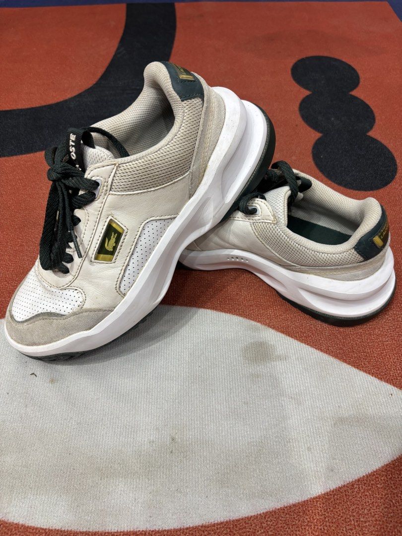 Lacoste White and Green Sneakers (Category: Sneakers) located in Alicia. Submitted by thriftbagph (Listing ID 1461078433, Image 1). Description: - White and green Lacoste sneakers - Lace-up style - Chunky sole - Iconic Lacoste logo on side and heel - Perfect for casual wear - Shows some signs of wear, but plenty of life left.