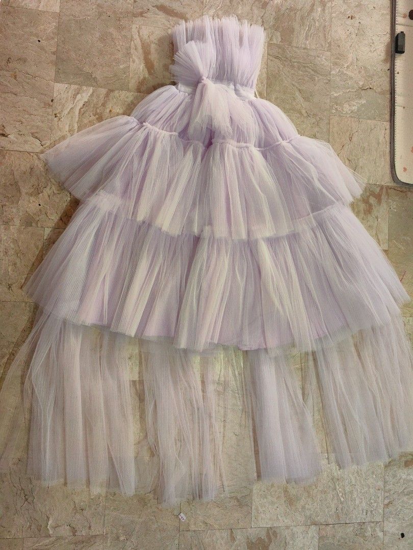 lavender tiered tulle gown (Category: Evening dresses & gowns) located in Calamba. Submitted by princesspauliney. (Listing ID 1461037799, Image 2). Description: Tube lavender tiered tulle gown. This style features a structured, pleated or gathered sweetheart bodice paired with a voluminous, multi-layered dramatic tulle skirt. It is a popular design choice for formal events, prom nights, and photoshoots. 50inches bust to foot Best fit 5'2 to 5'4.