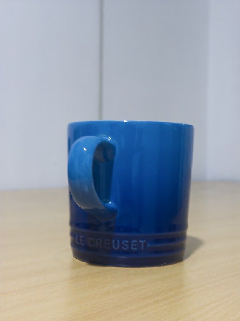 Le Creuset Blue Stoneware Mug (Category: Coffee & Tea Tableware) located in Manila. Submitted by jaggylejano (Listing ID 1461022760, Image 2). Description: - Classic blue mug from Le Creuset - Made of durable stoneware - Ideal for coffee or tea - Dishwasher and microwave safe.
