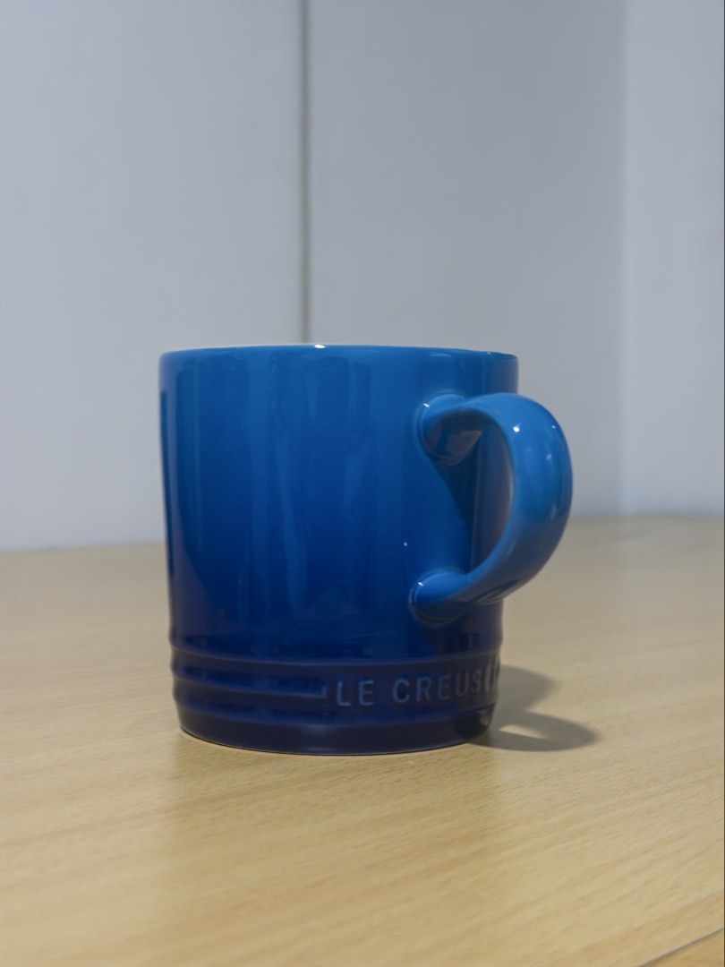 Le Creuset Blue Stoneware Mug (Category: Coffee & Tea Tableware) located in Manila. Submitted by jaggylejano (Listing ID 1461022760, Image 1). Description: - Classic blue mug from Le Creuset - Made of durable stoneware - Ideal for coffee or tea - Dishwasher and microwave safe.