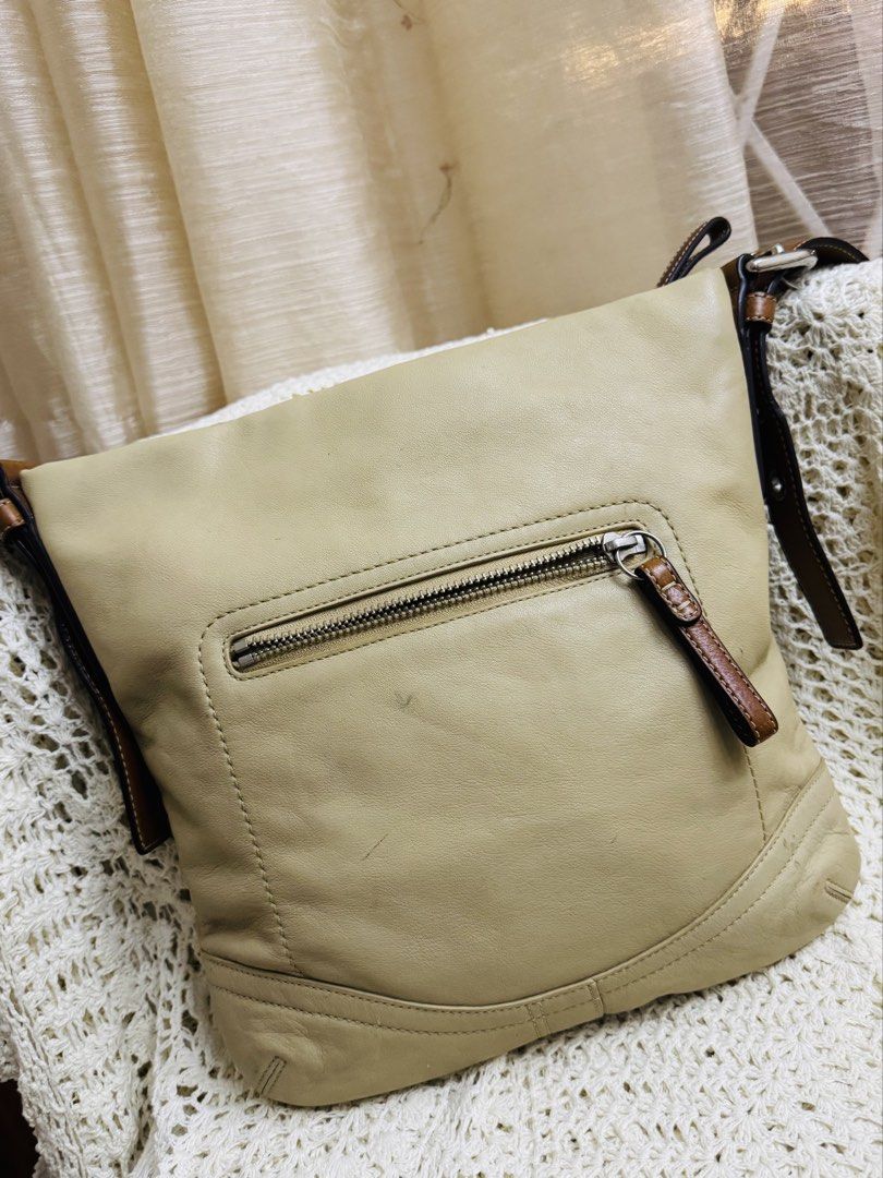 Leather Hobo Shoulder Bag Beige (Category: Luxury Bags & Wallets) located in Bacolod City. Submitted by vintage_vogue6100 (Listing ID 1461043107, Image 2). Description: - Material: Natural Cowhide Leather - Color: Beige with Brown Leather Straps - Closure: Top Zipper - Exterior Pocket: 1 Zip Pocket - Interior Pockets: 1 Zip Pocket, Slip Pockets - Serial Number: J0782-F10938 - Style: Great everyday bag.